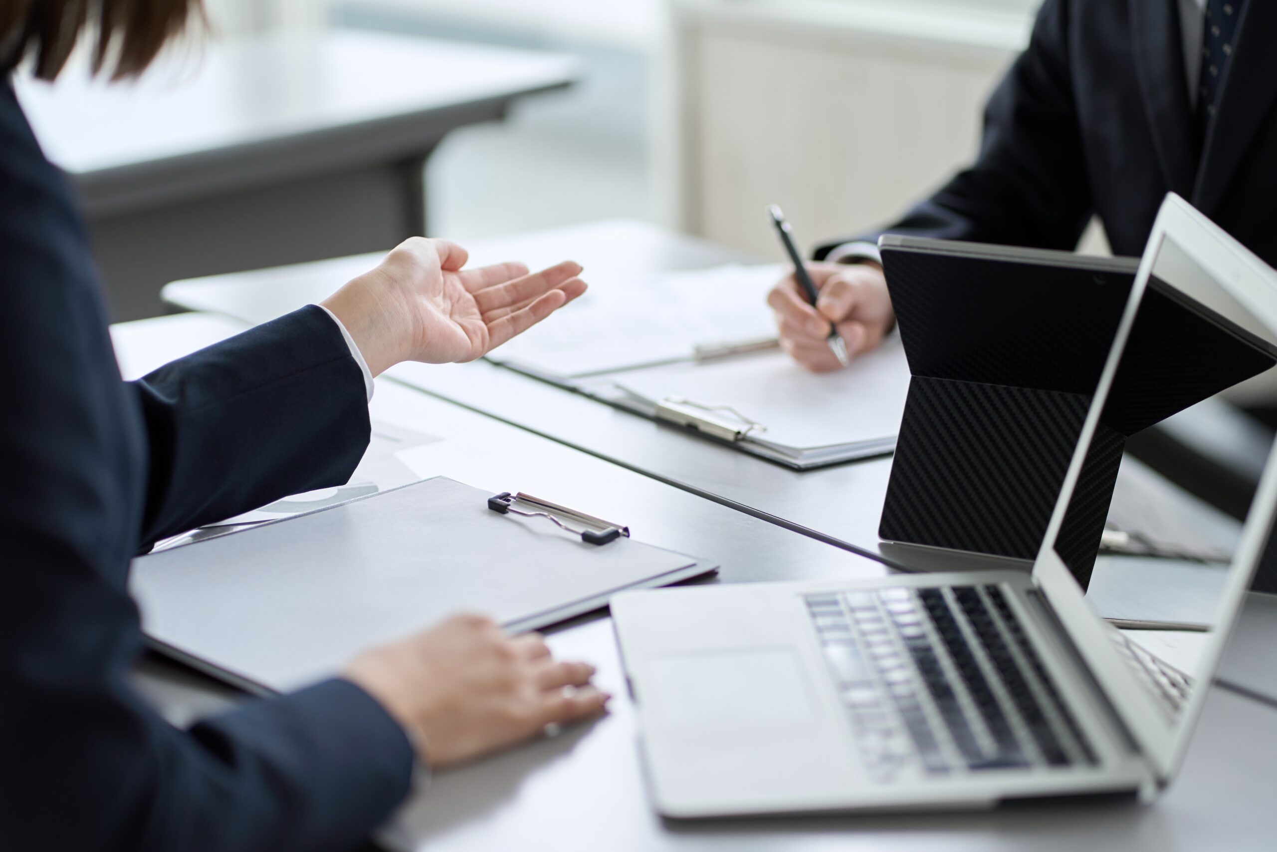 External investigator conducting a workplace investigation interview within someone across a table