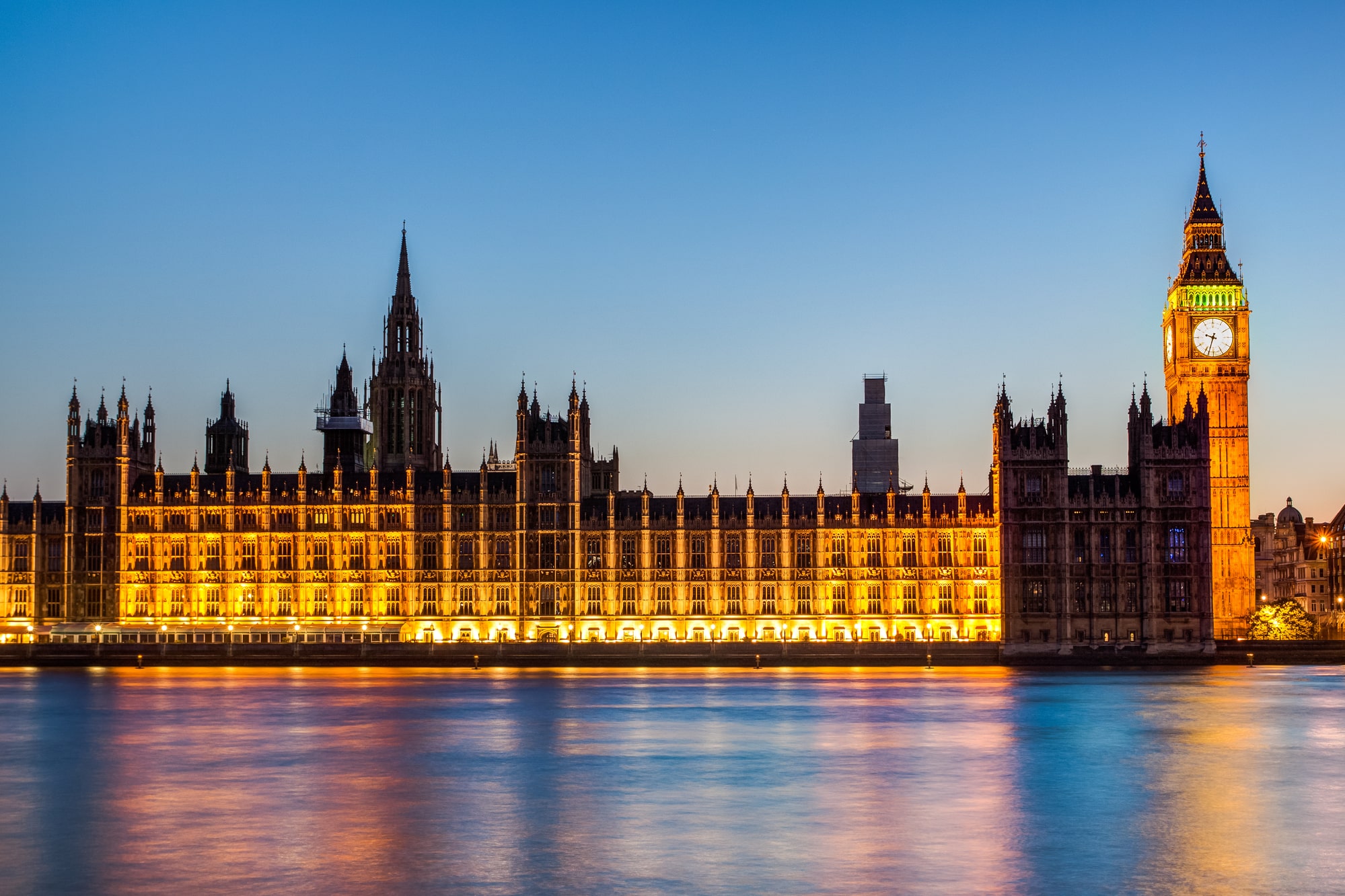 Night time photograph of the House of Lords from the river Thames