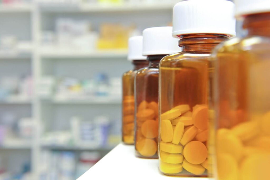 bottles of tablets in a pharmacy