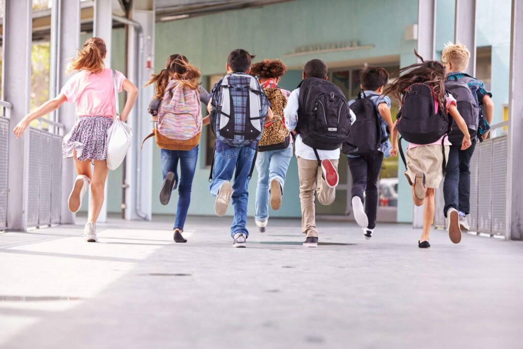 school children running down the hallway