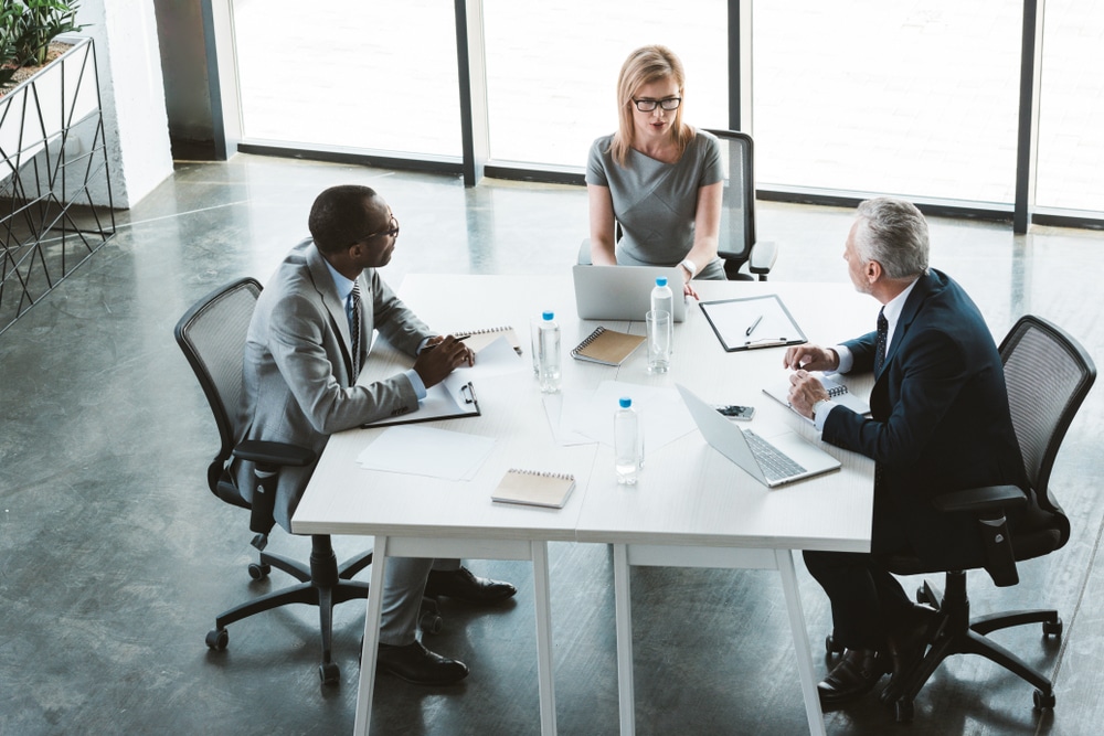 high angle of three business professionals having a meeting