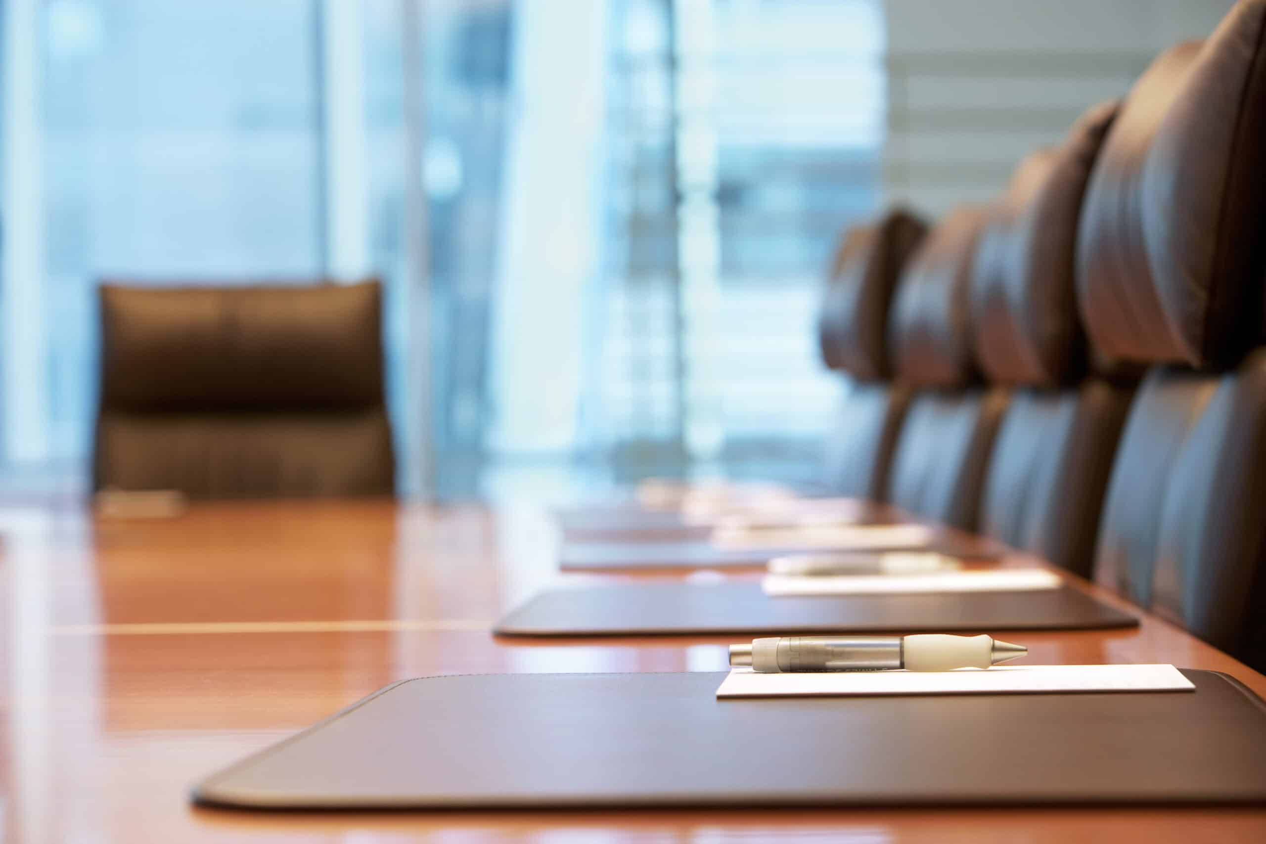 close up of a table in an empty board room