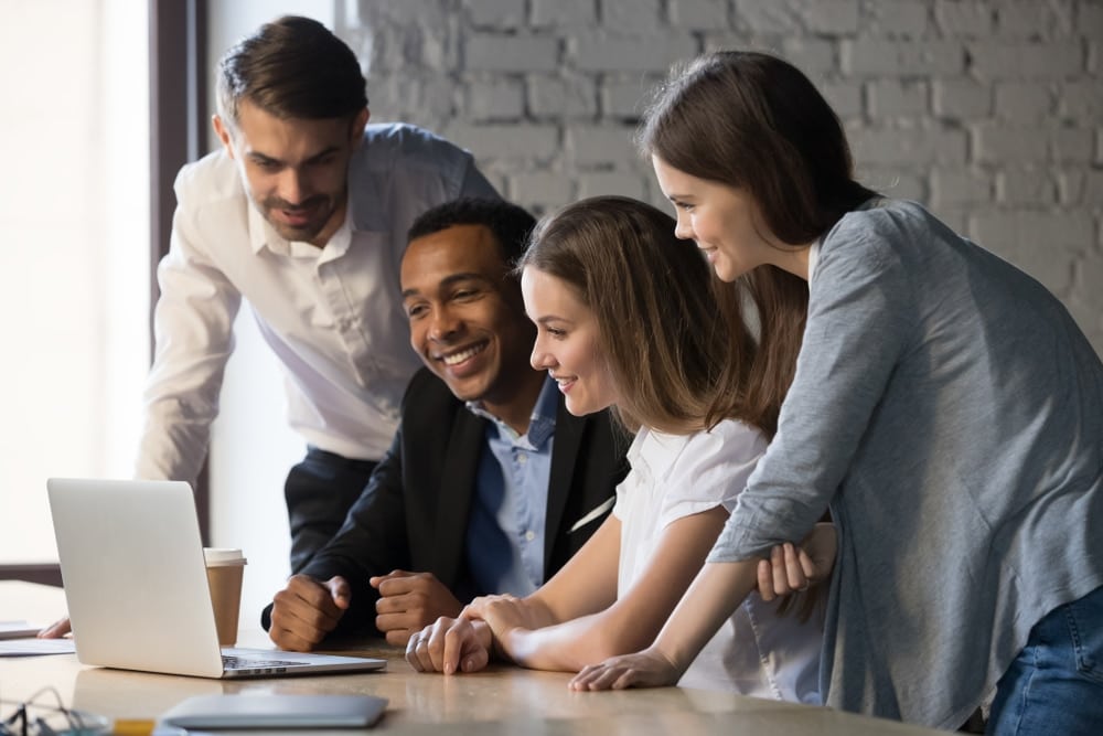 Smiling,Diverse,Employees,Or,Students,Team,Watching,Webinar,On,Laptop