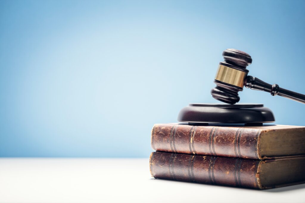 Gavel on top of 2 books