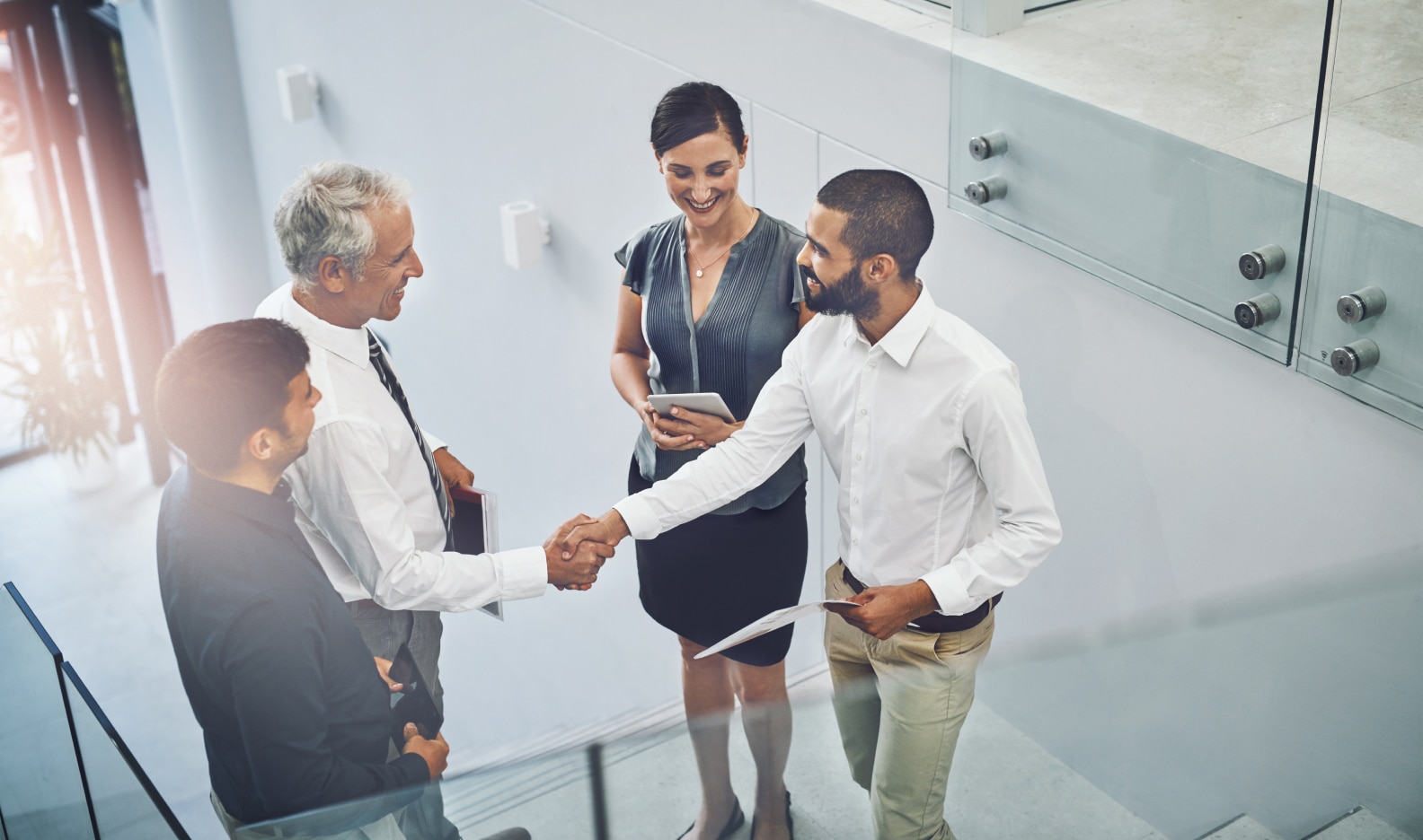 Two men shaking hands in an office