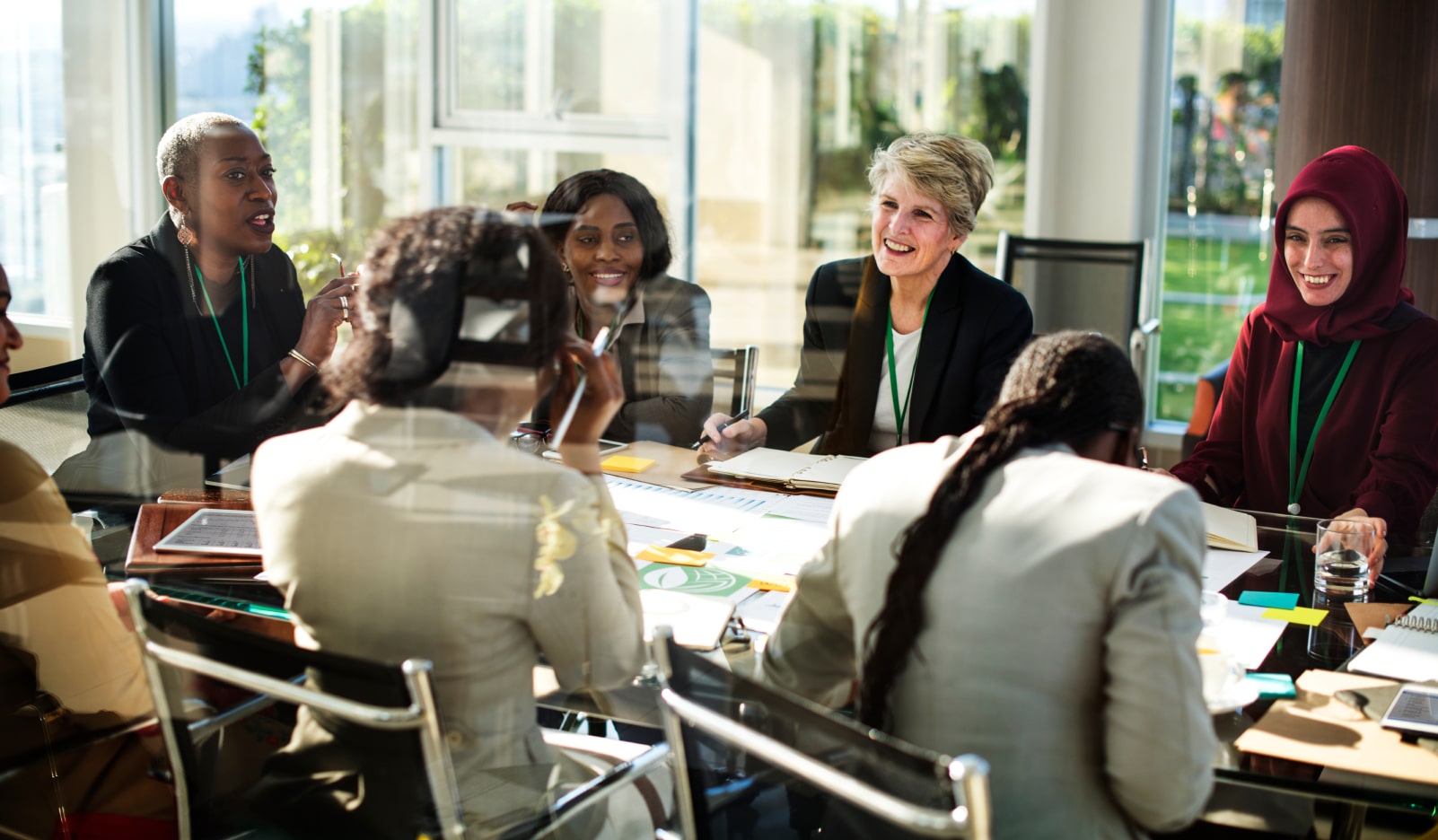 colleagues sat around a table in an office having a meeting