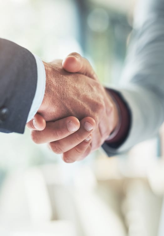 close up of two men shaking hands