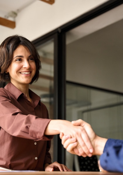 Woman shaking someones hand