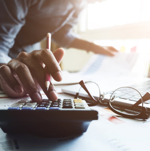 close up of a person using a calculator