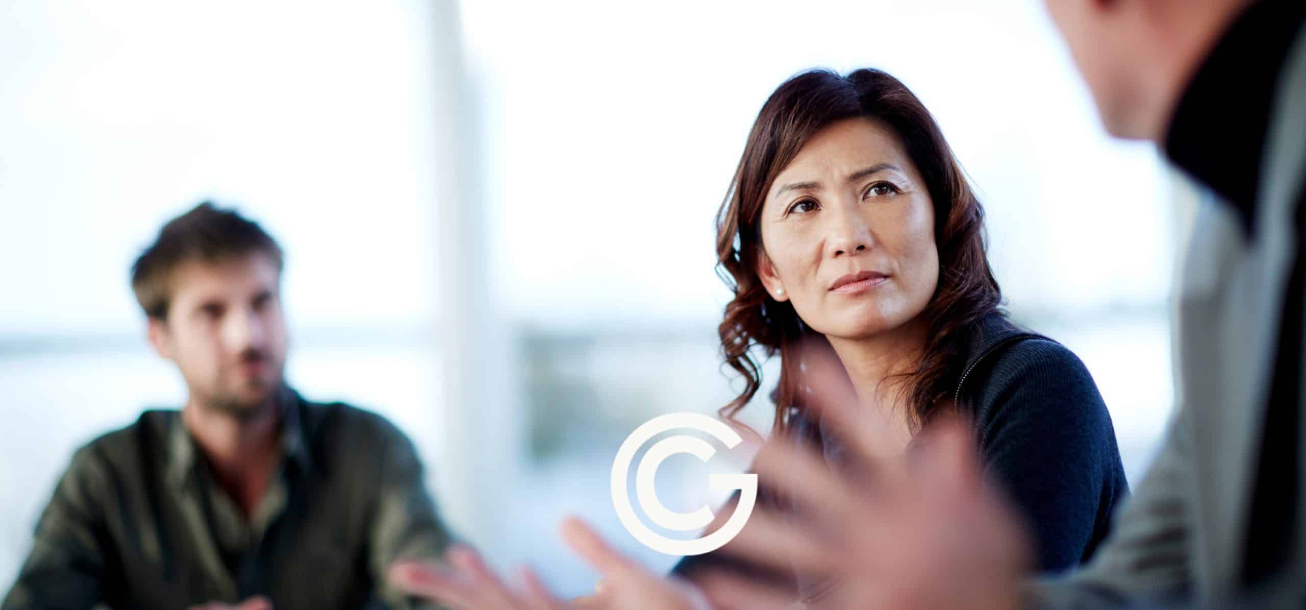 Woman conducting an interview with two other people