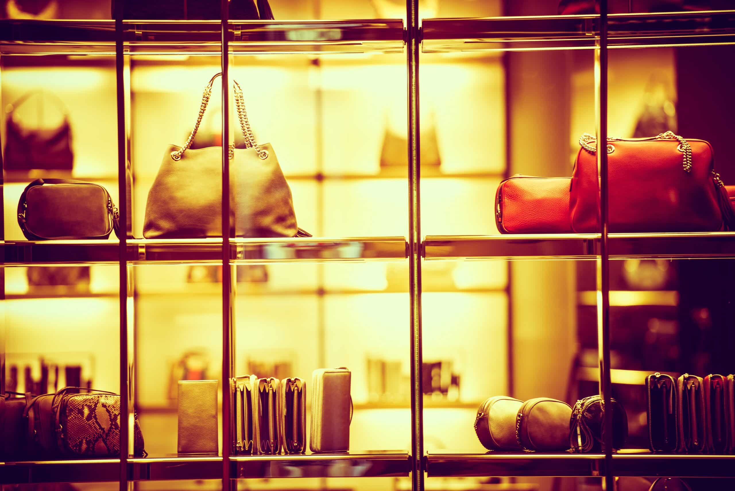 Luxury purses on shelves in a storefront