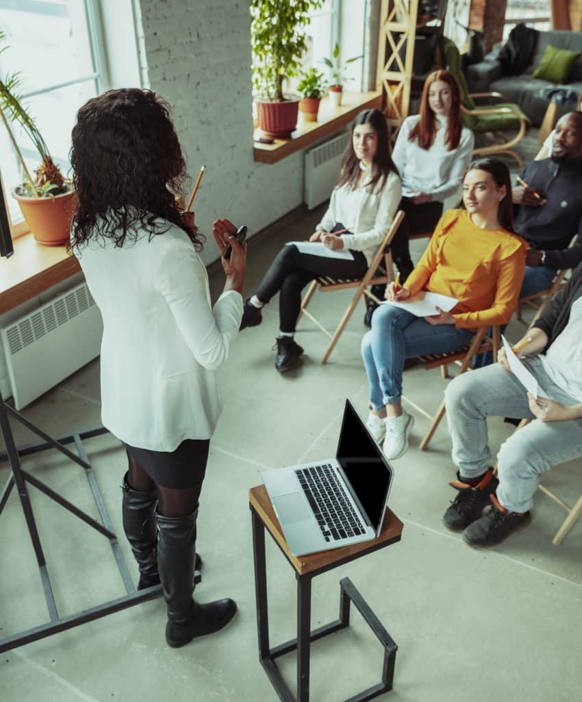 female speaker giving training presentation