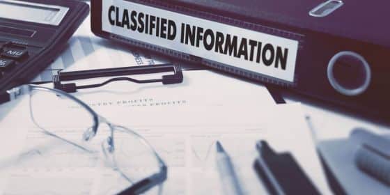 folder with the words 'classified information' on the side