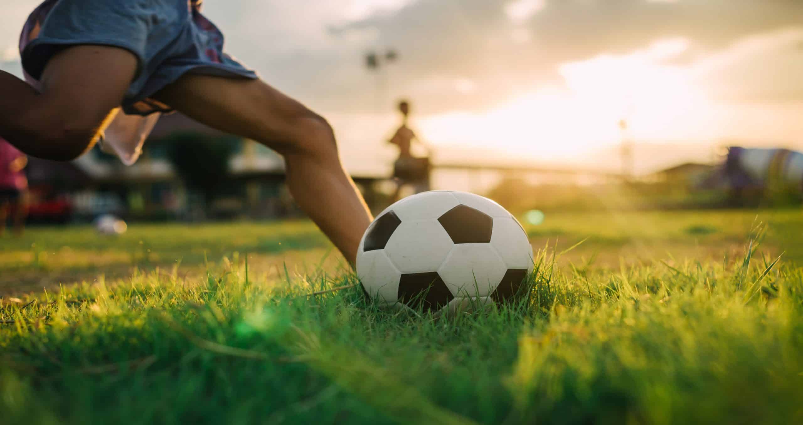 Child playing football