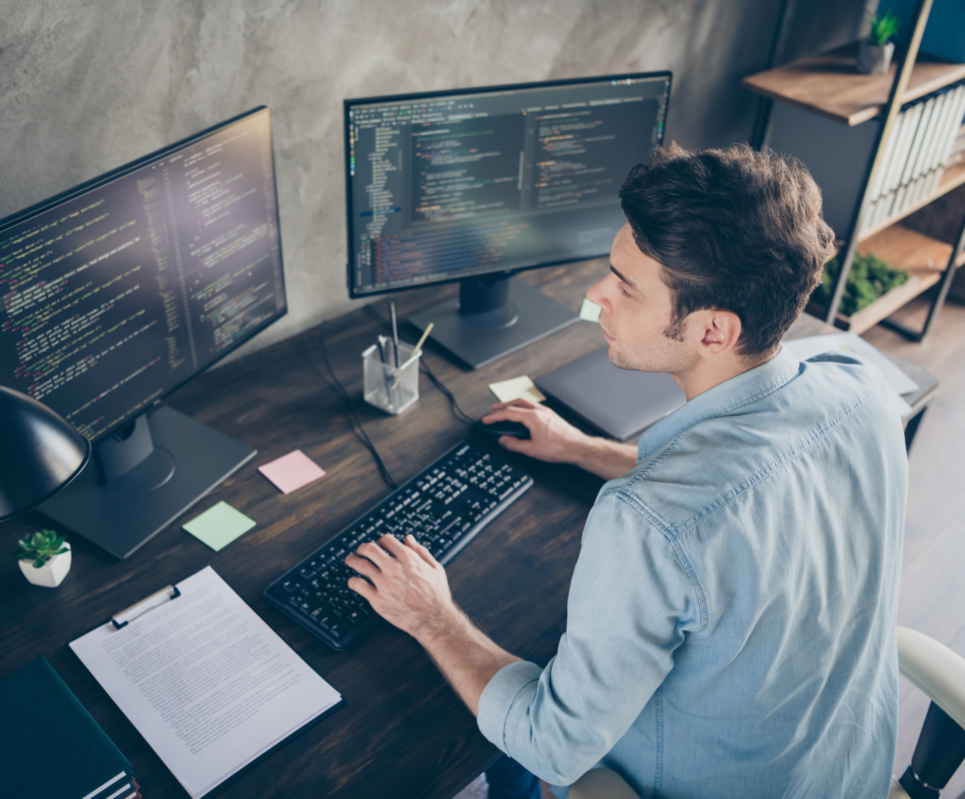 Man working on codes at his computer