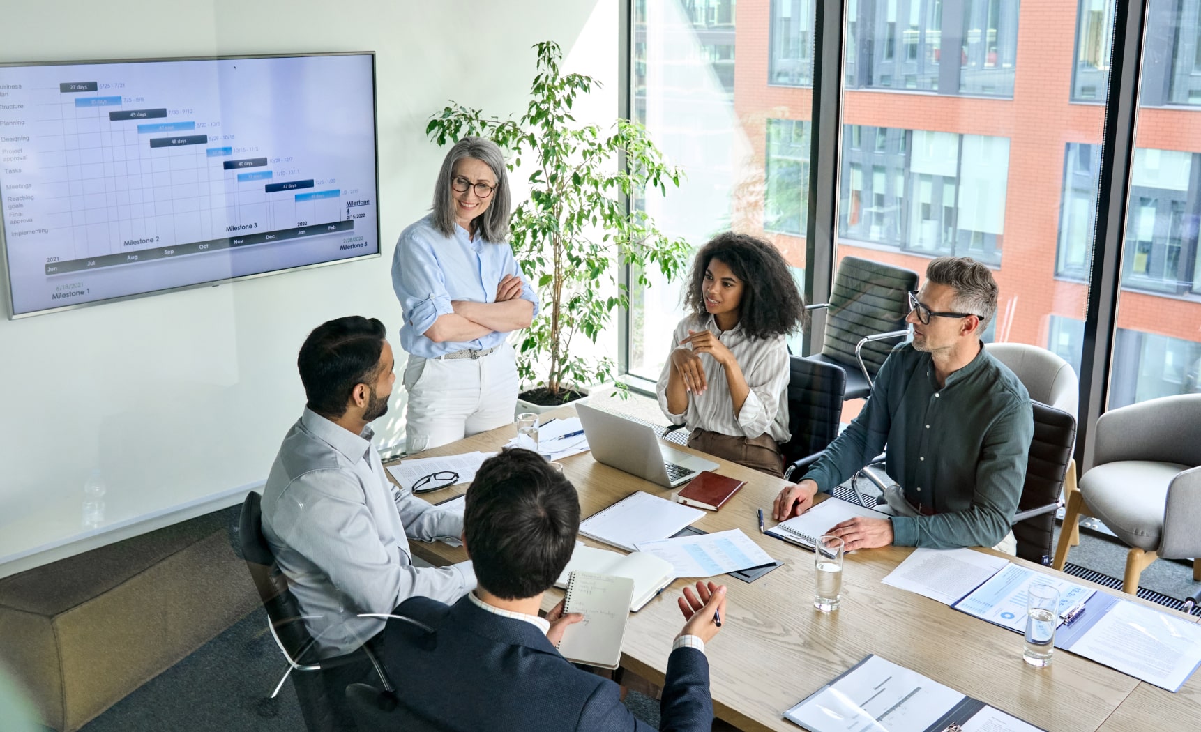 A team of people having a meeting around an office table