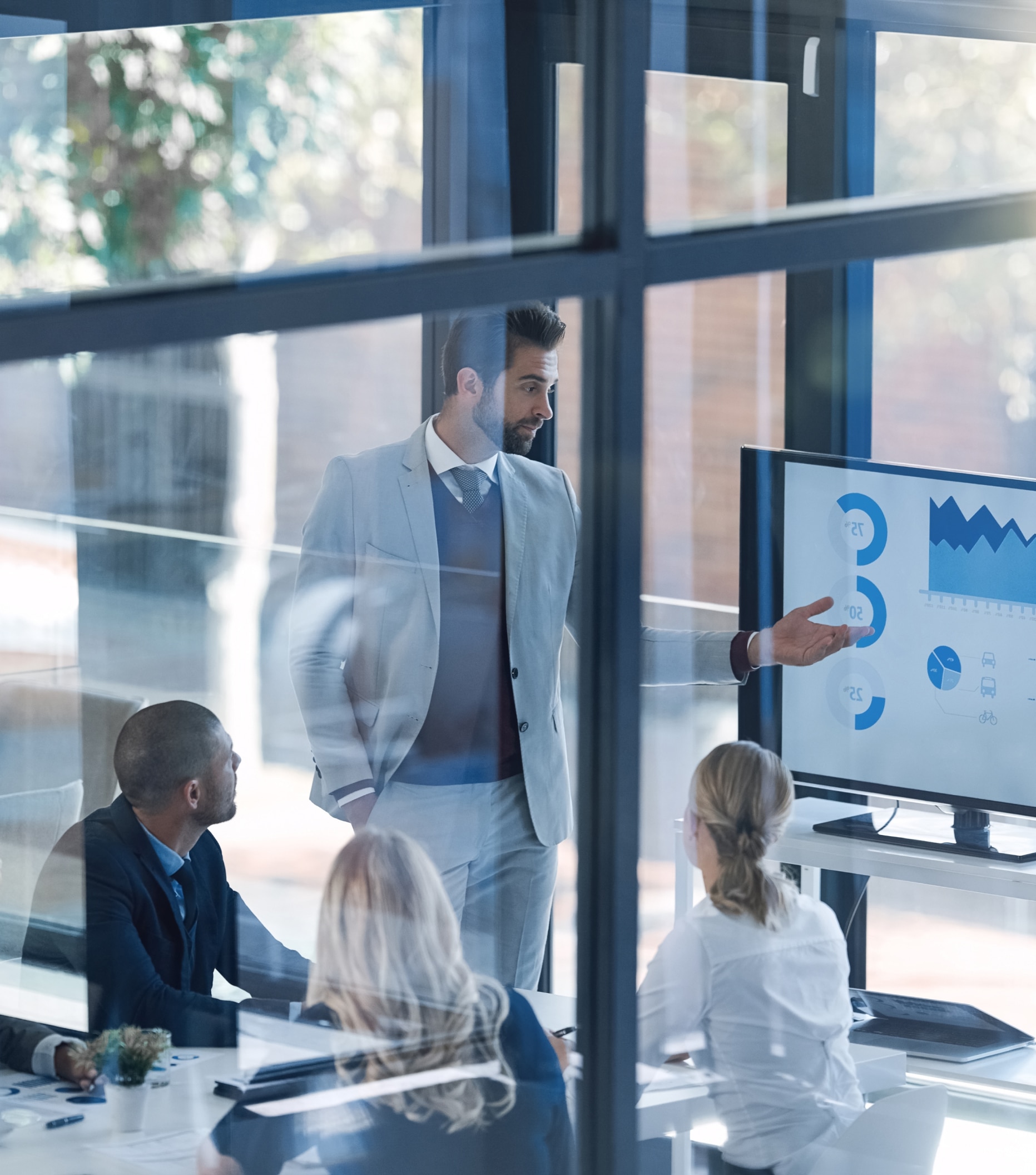 Man giving a presentation to company board members