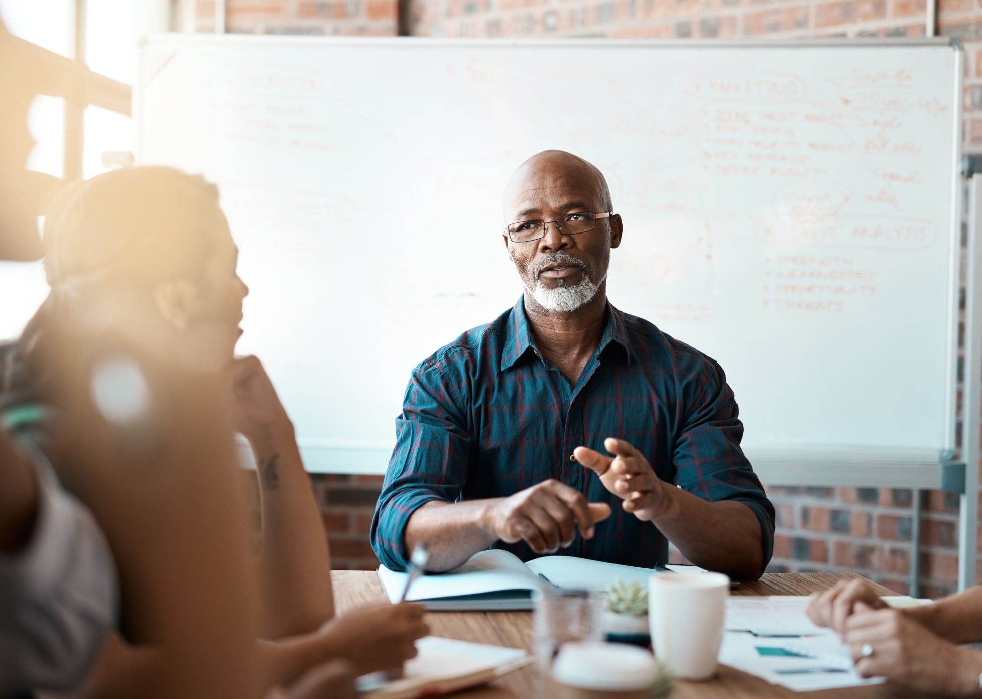 man leading a team meeting