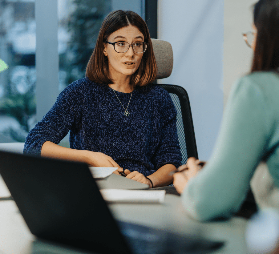 one woman interviewing another woman in an office