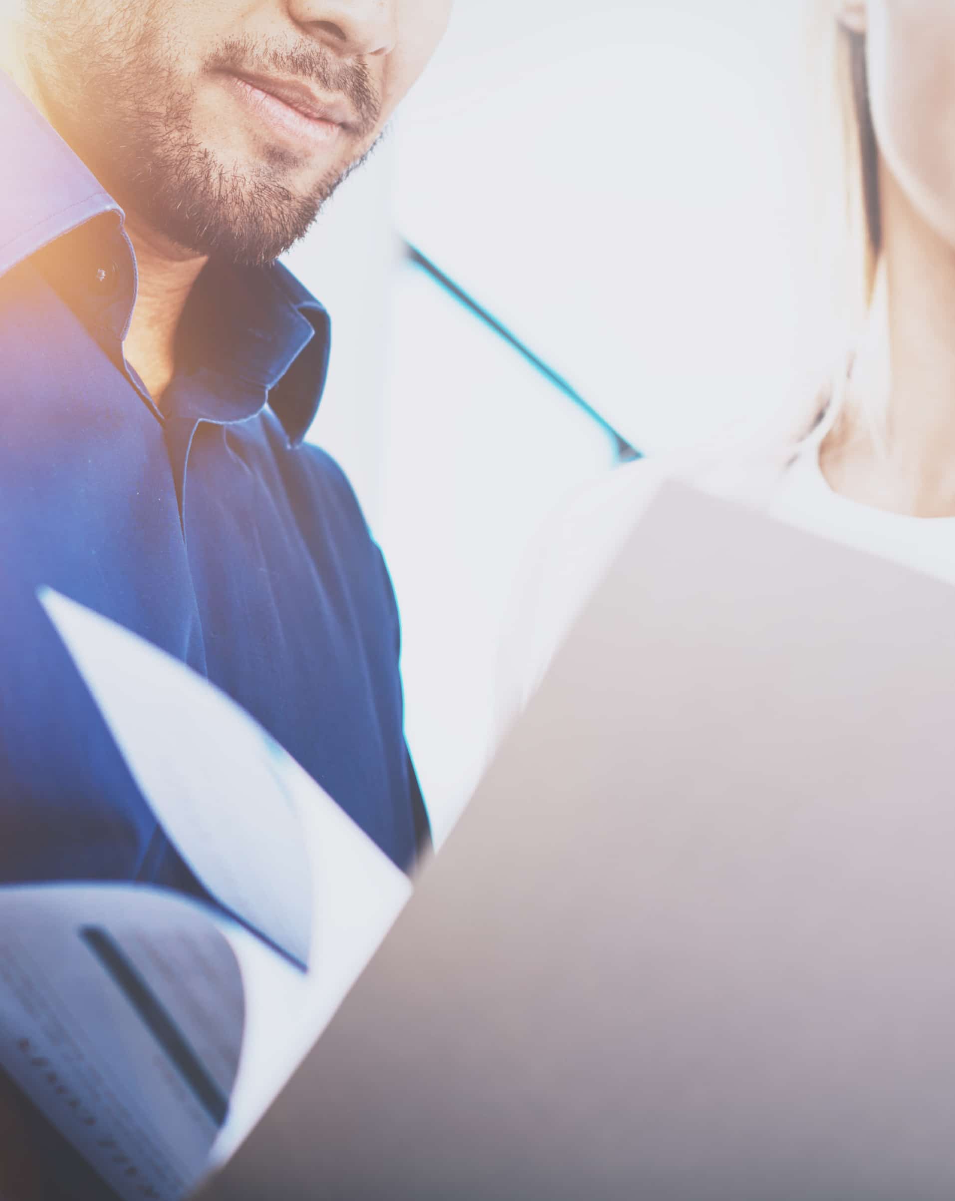 Close up of man and woman going through documents