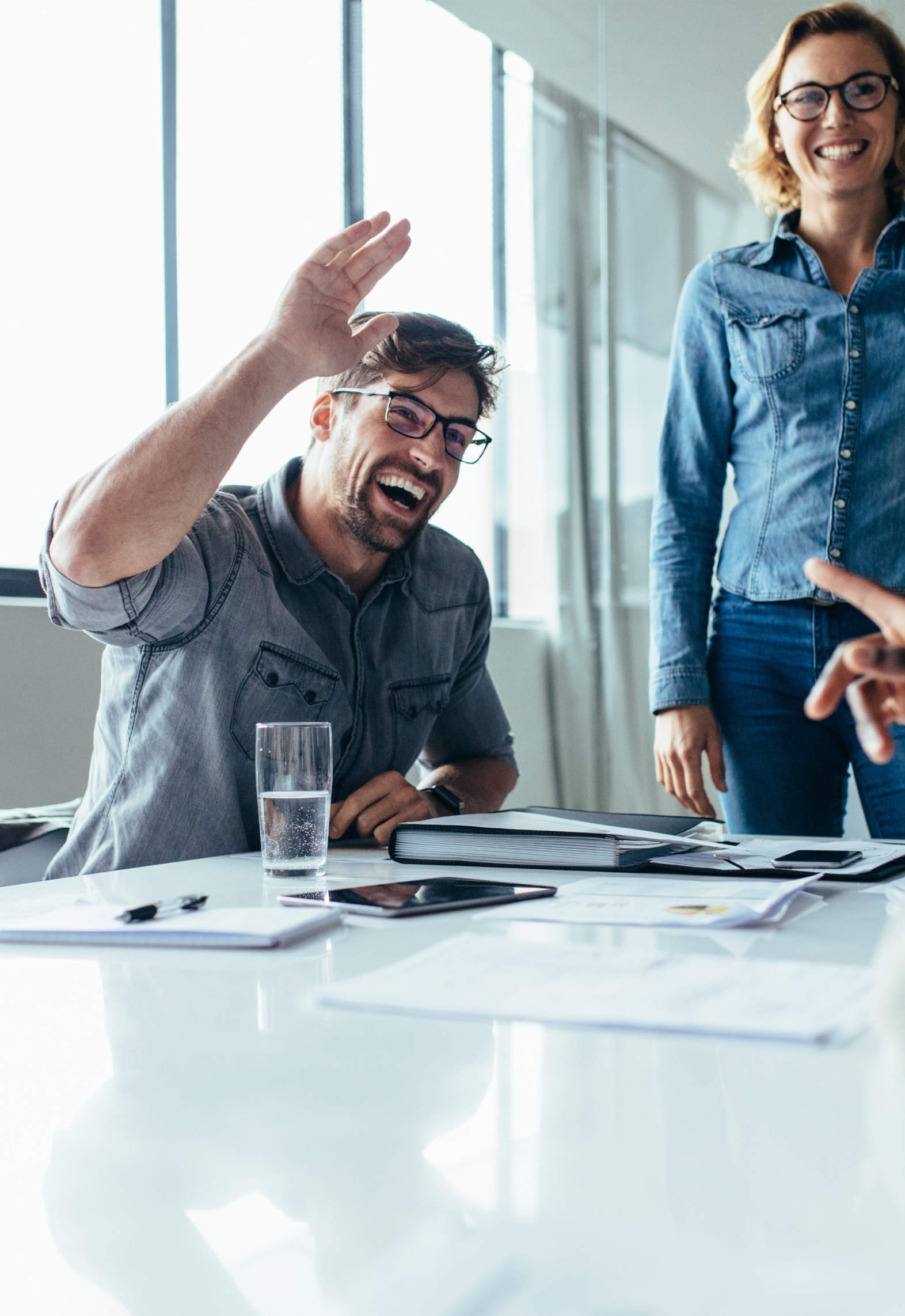 Man giving a high five to his colleague