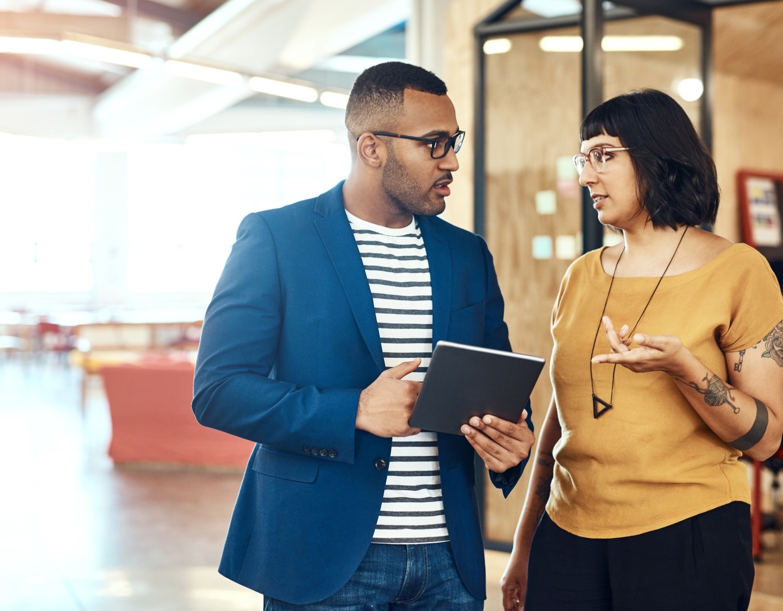 two business people having a conversation in an office